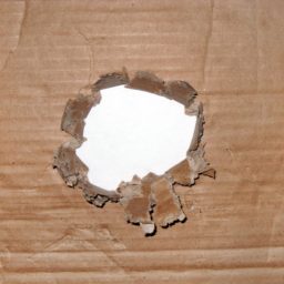 Torn cardboard hole brown iPad / Air / mini / Pro Wallpaper